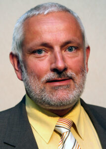 Dr. Burk­hard John
